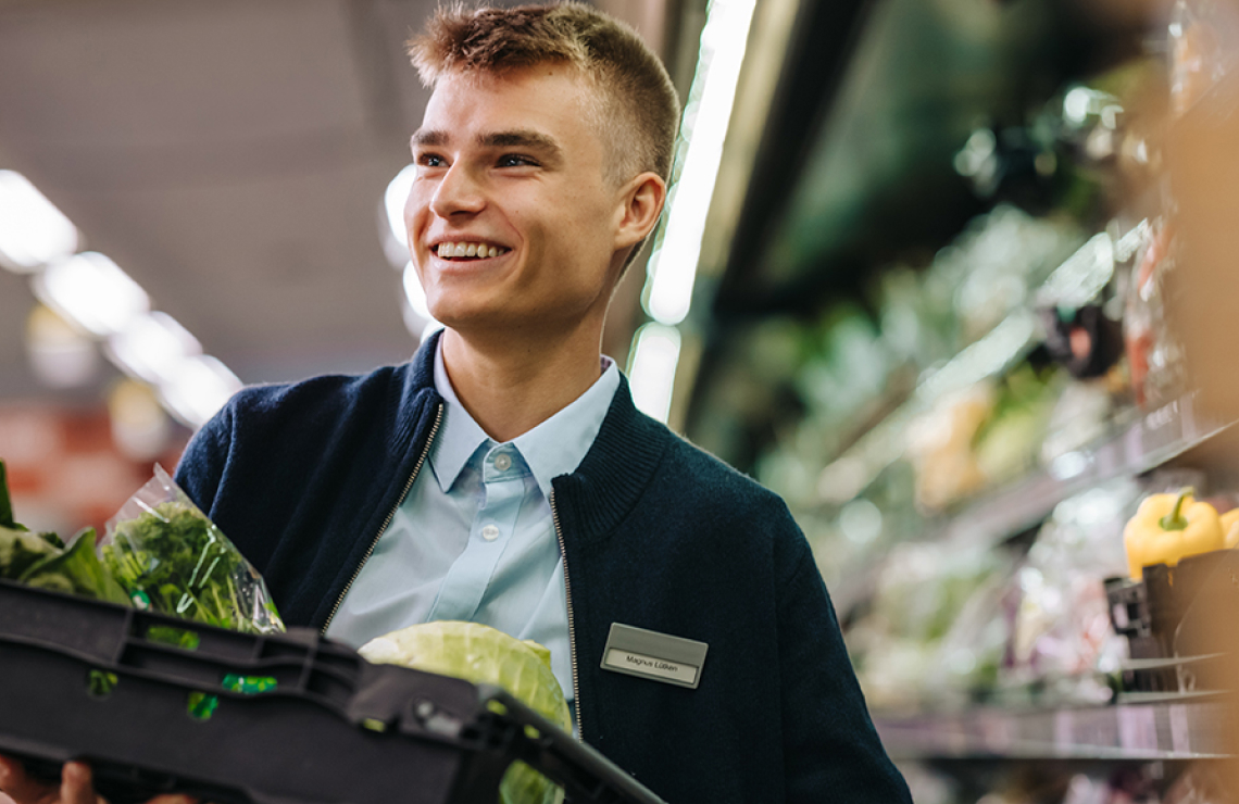 grocery worker smiling