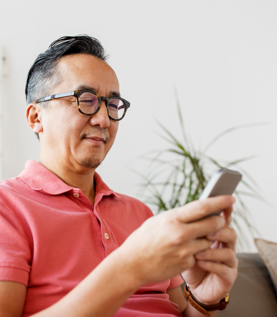 Man using phone for telehealth appointment