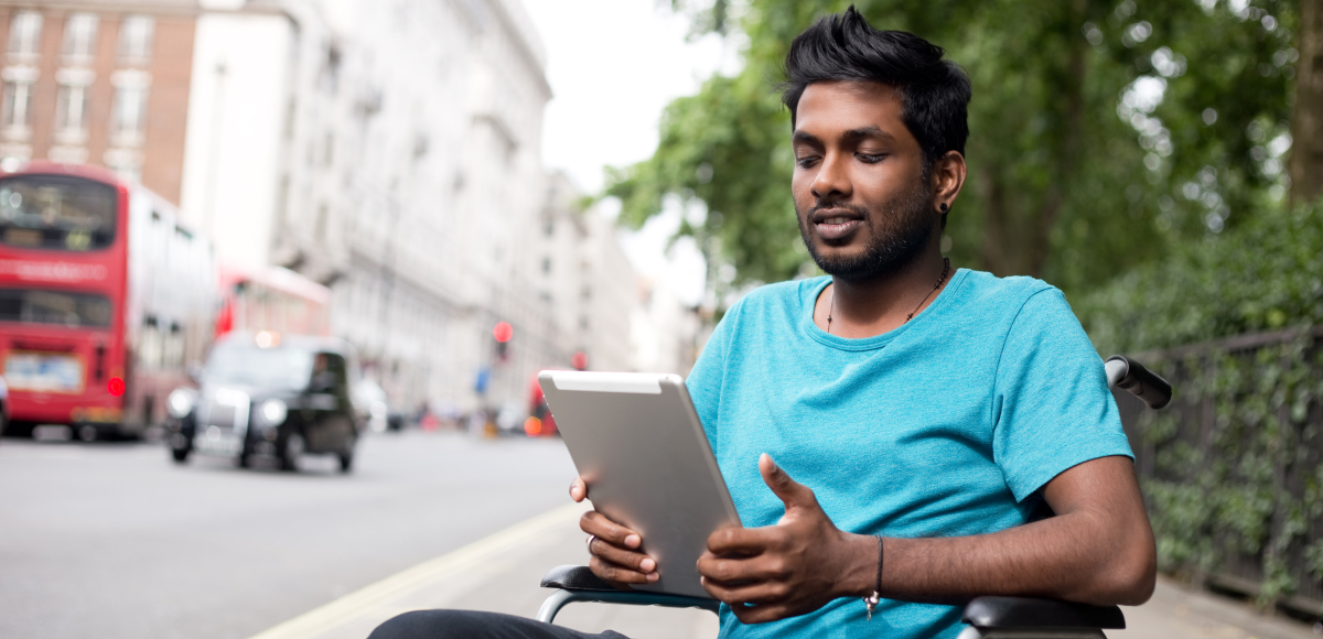 man with ipad having telehealth appointment