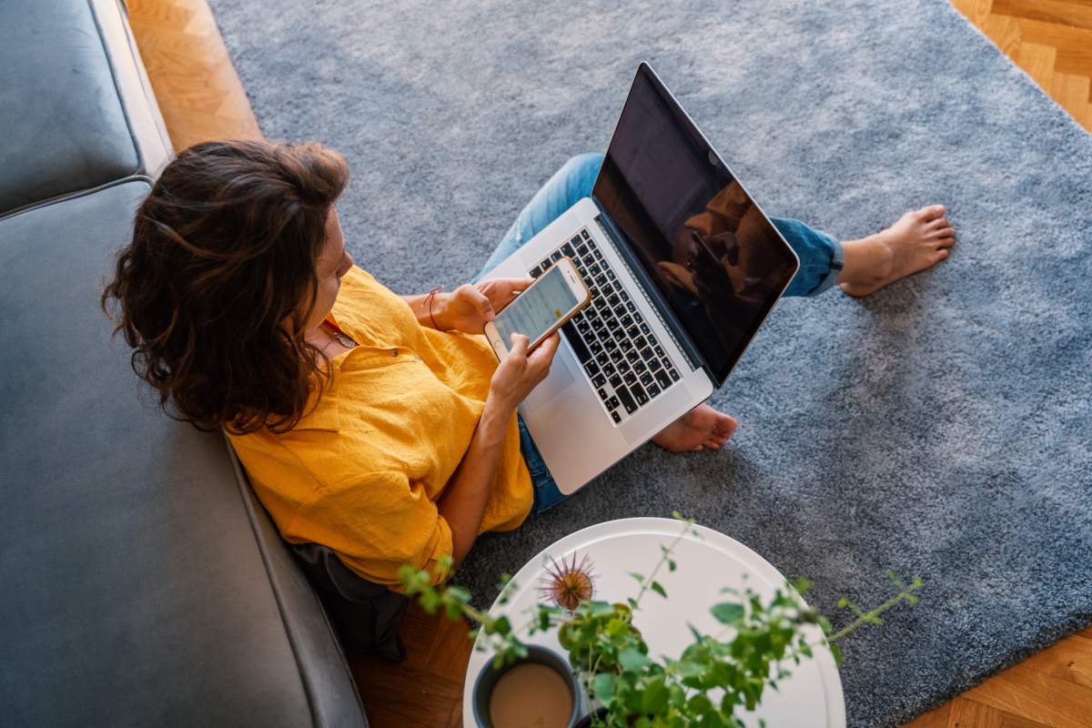 woman having telehealth visit on couch