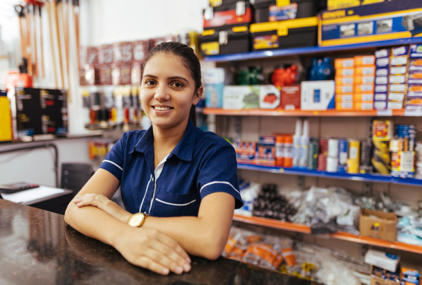 Gas station employee smiling