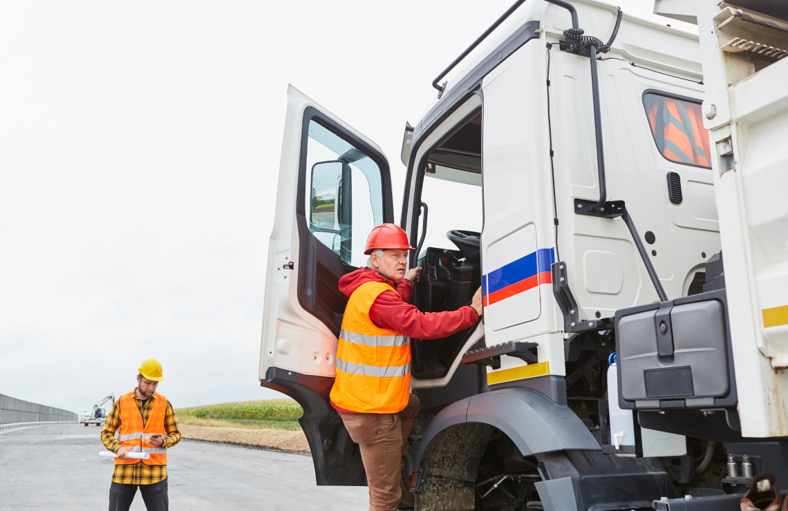 transportation worker getting into his truck