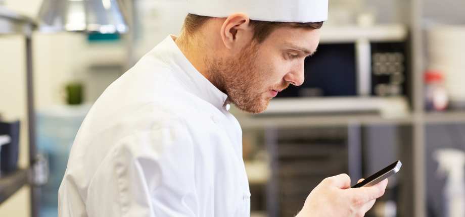 Chef on phone with doctor at work