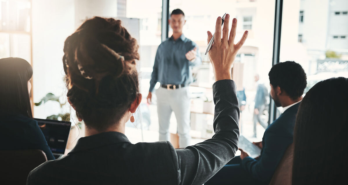 Human Resources professional raising hand